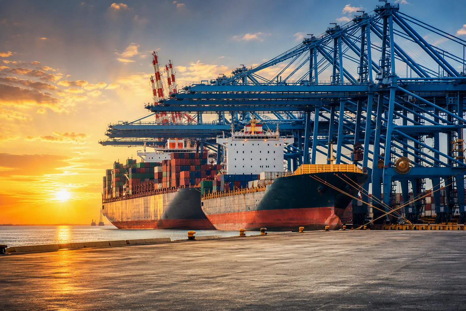 Cargo ship being loaded at a port